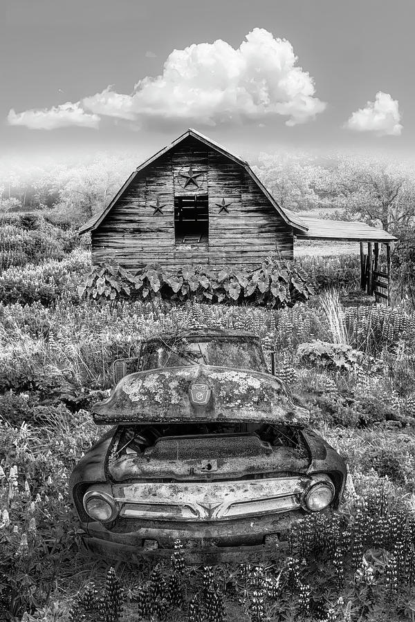 Rusty Ford by the Star Barn Black and White Photograph by Debra and Dave Vanderlaan