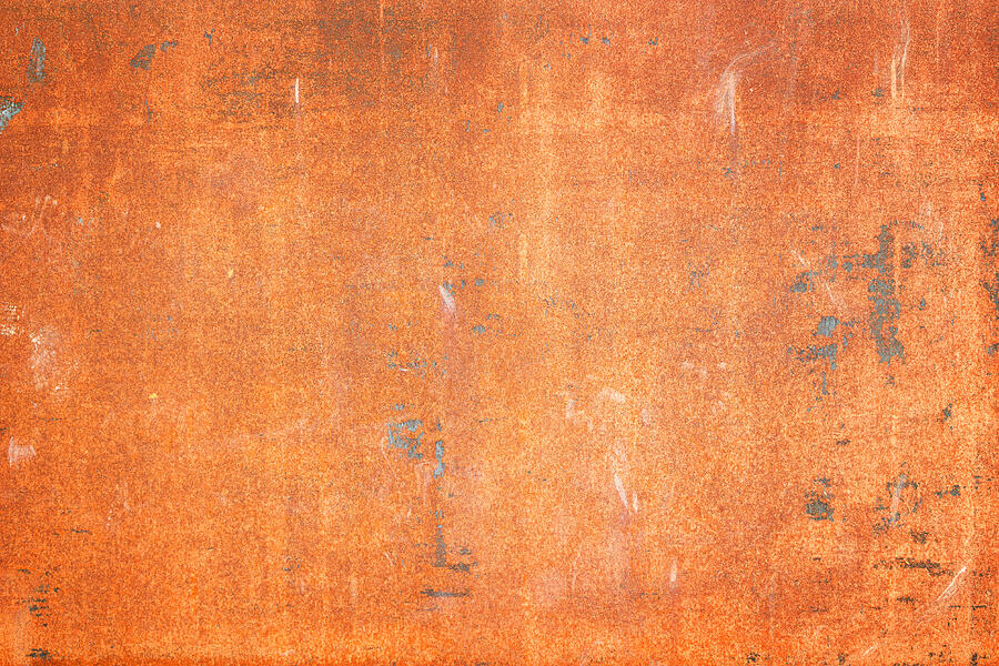 Rusty old sheet metal plate background texture with vignetting. Photograph by Tuomas A. Lehtinen