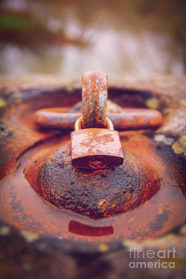Rusty padlock locked around an aged iron ring Photograph by Mendelex Photography