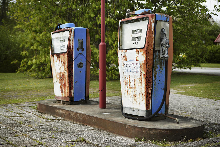 Rusty petrol pumps on a gas station. Photograph by Per Magnus Persson