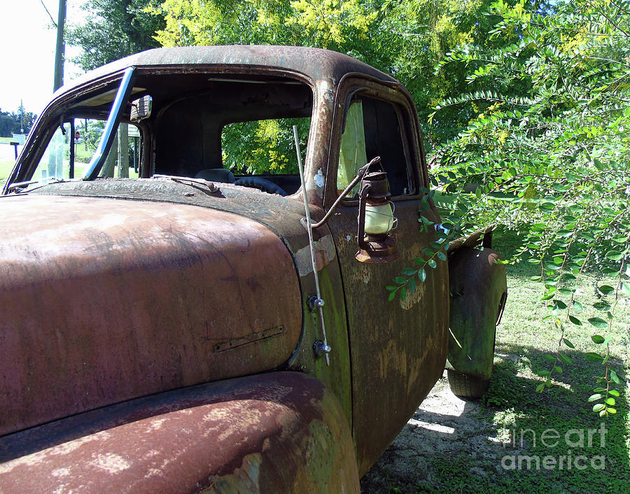 Rusty Truck Lamp Photograph by D Hackett