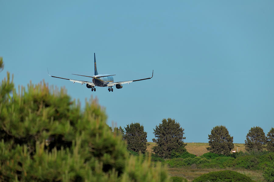 Ryanair Plane Landing at Faro Airport Photograph by Angelo DeVal