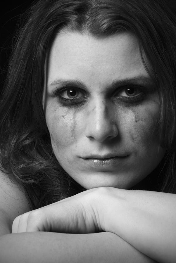 Sad womans face with strong and tough expression, smeared makeup Photograph by Alina555