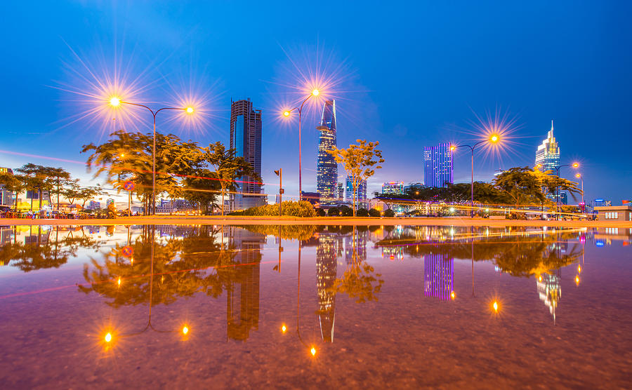 Saigon blue hour over  reflection - Saigon the biggest city in Vietnam Photograph by Ho Ngoc Binh