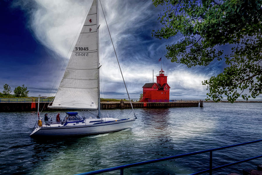 Sailboat at the Holland Harbor Lighthouse Photograph by Debra and Dave Vanderlaan