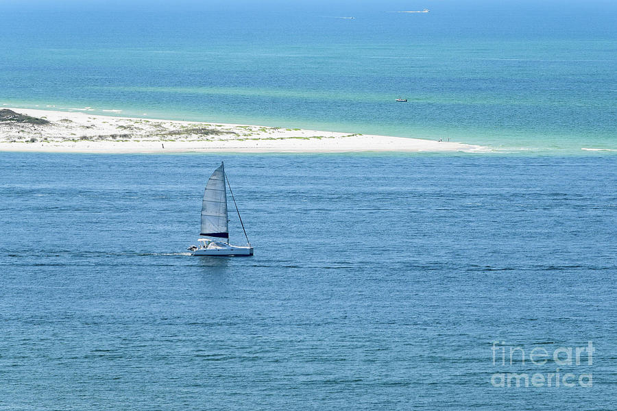 Sailboat at the tip of the Island Photograph by Beachtown Views