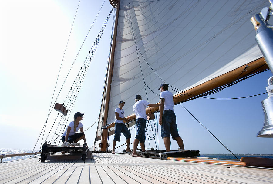 Sailboat captain and crew working on deck, ground view Photograph by Schultheiss Selection GmbH & CoKG