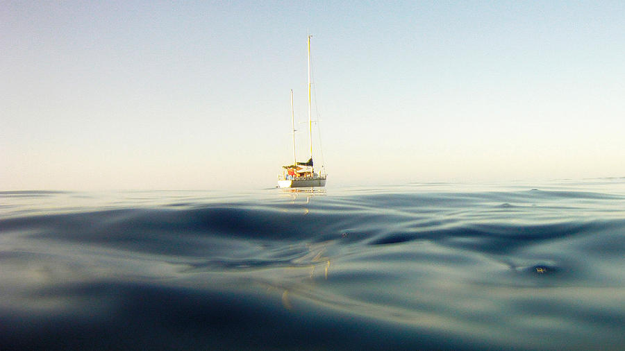 Sailboat in the middle of the sea Photograph by Alejandro Esteve
