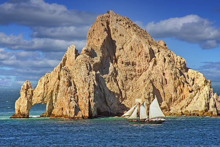 Sailboat Passing Rocks in Cabo San Lucas Photograph by Darryl Brooks