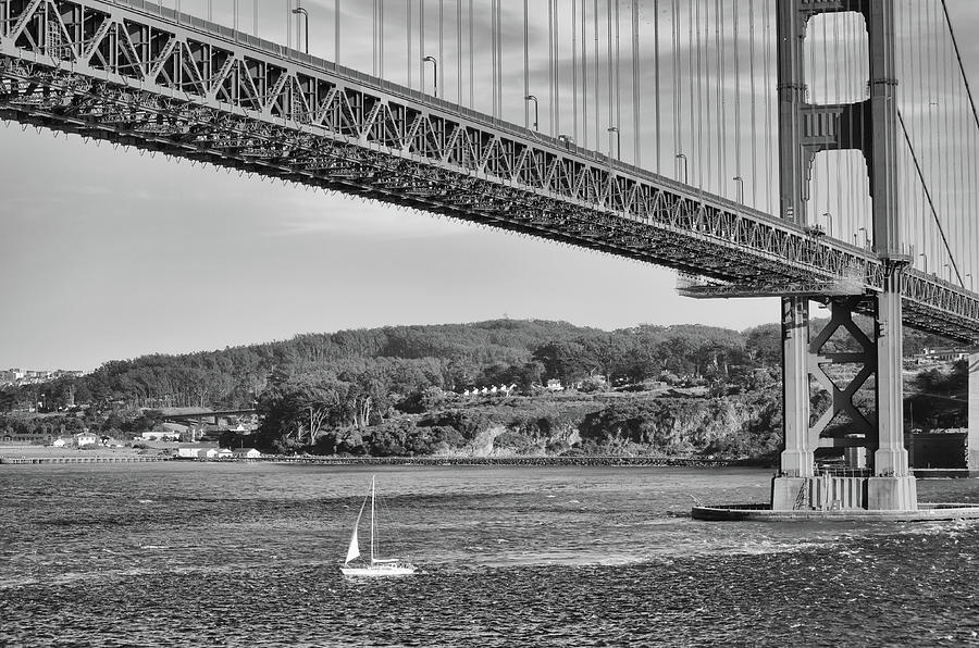 Sailboat Passing Under the Mighty Golden Gate Bridge San Francisco Black and White Photograph by Shawn OBrien