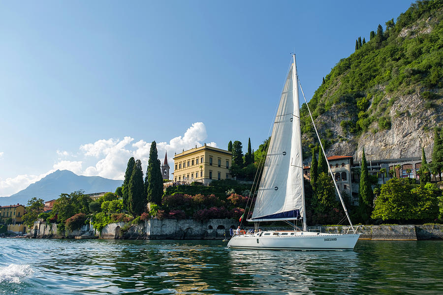Sailboat sailing past colorful Italian villas, Lake Como Photograph by David L Moore