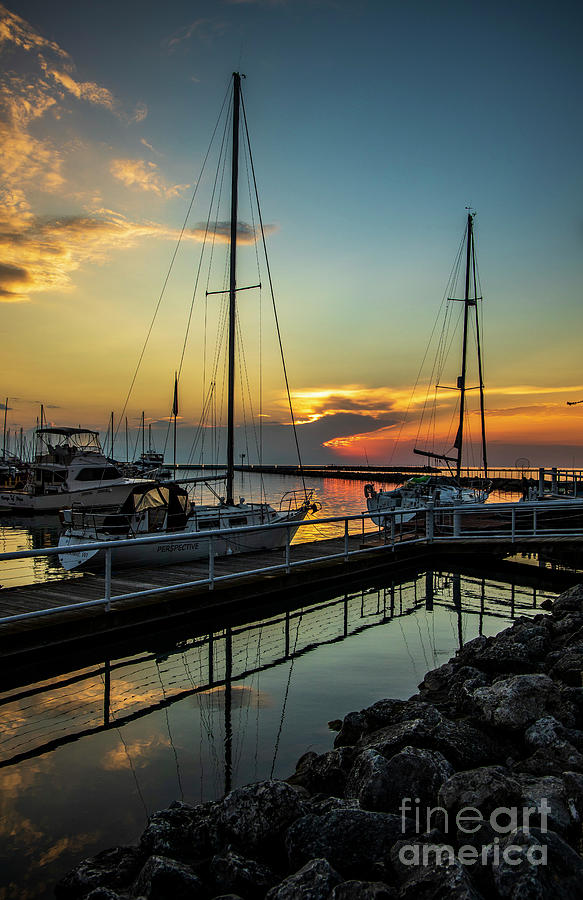 Sailboats at sunrise in Port Washington Photograph by Eric Curtin