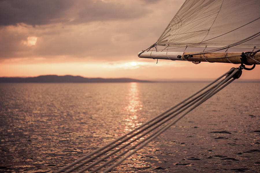 Sailing at sunset Photograph by Scott Rackers