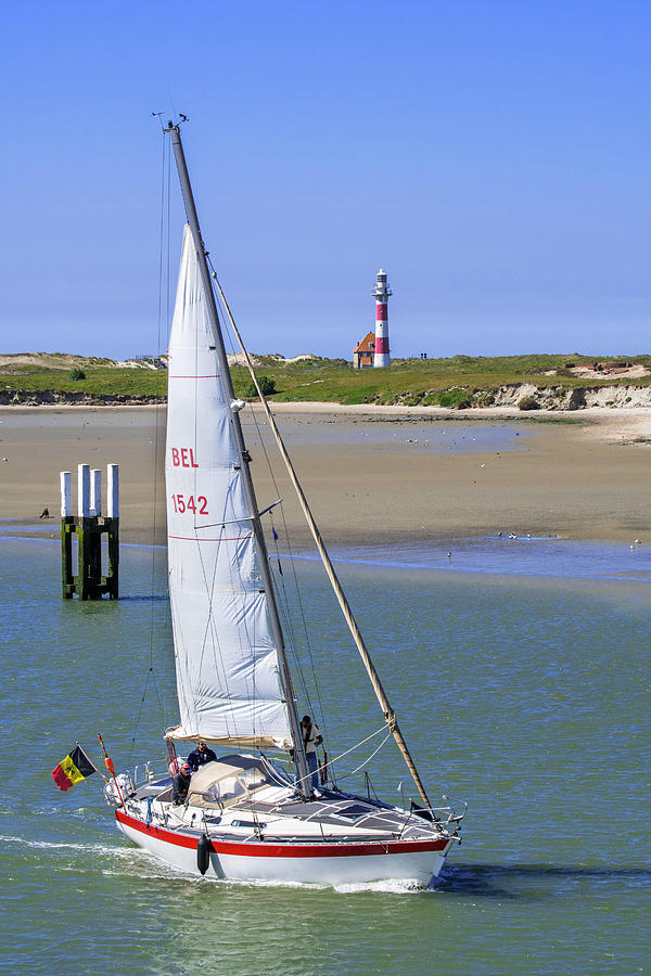 Sailing Boat and Lighthouse Photograph by Arterra Picture Library