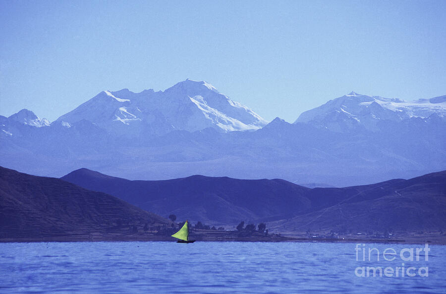 Sailing boat on Lake Titicaca and Mt Chearoco Photograph by James Brunker