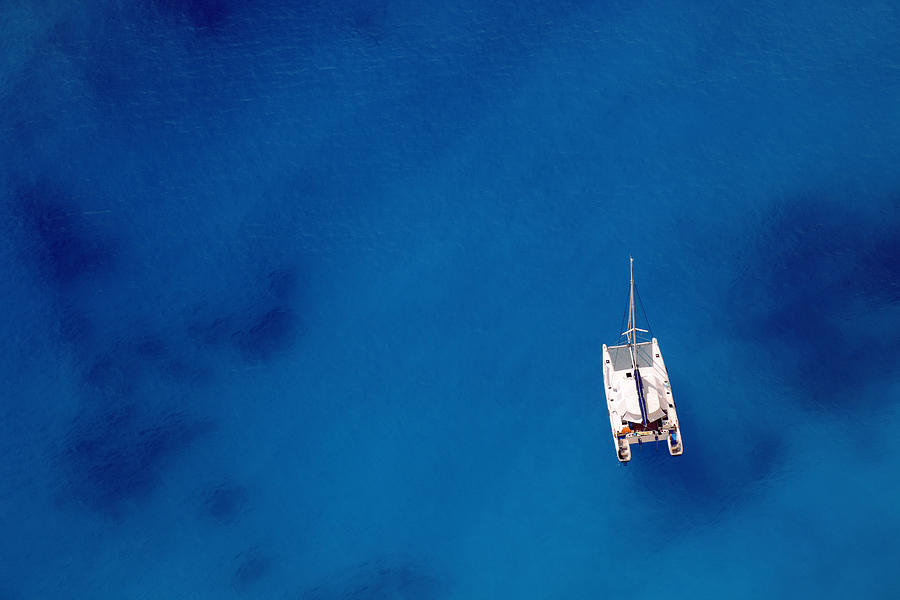 Sailing ship on an ocean of blue Photograph by TadejZupancic