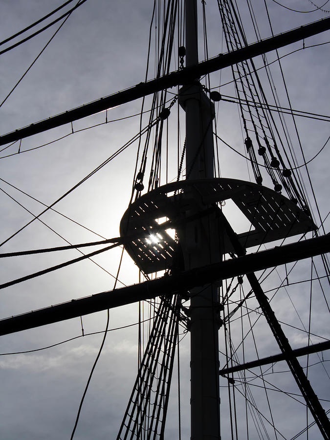 Sailing ship rigging backlit by sun Photograph by Charles Floyd