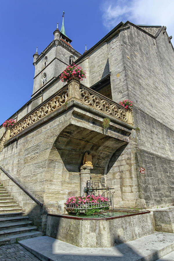 Saint-Laurent collegiate church and fountain in Estavayer-le-lac Photograph by Elenarts - Elena Duvernay photo