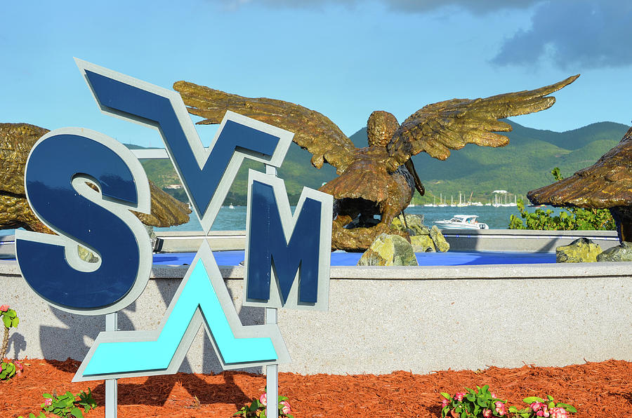 Saint Martin sint maarten Airport sign pelican statues caribbean Photograph by Toby McGuire