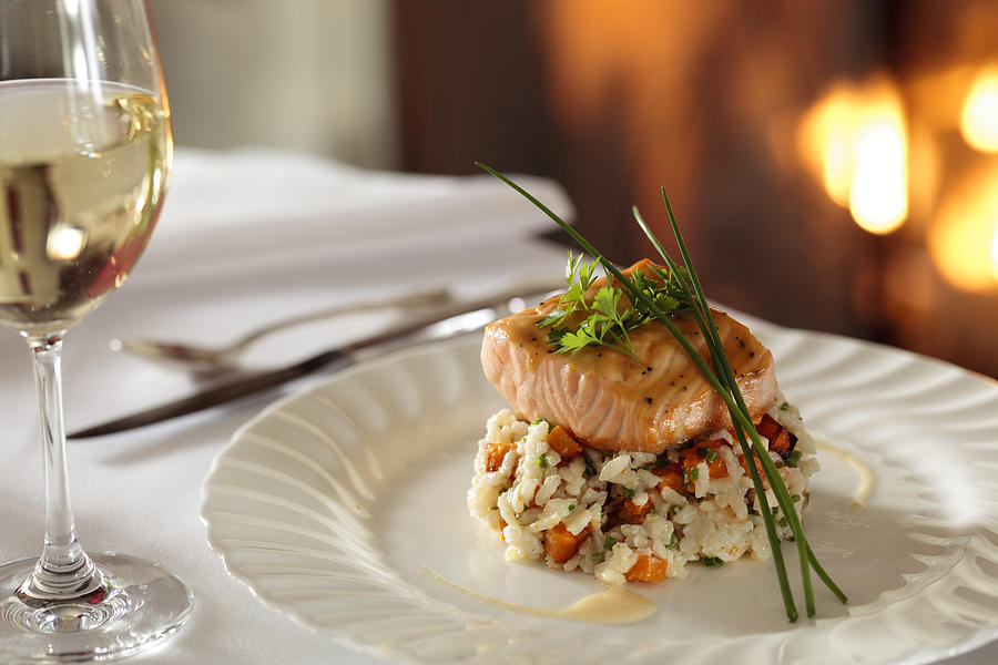 Salmon over rice by fireplace Photograph by Jon Lovette