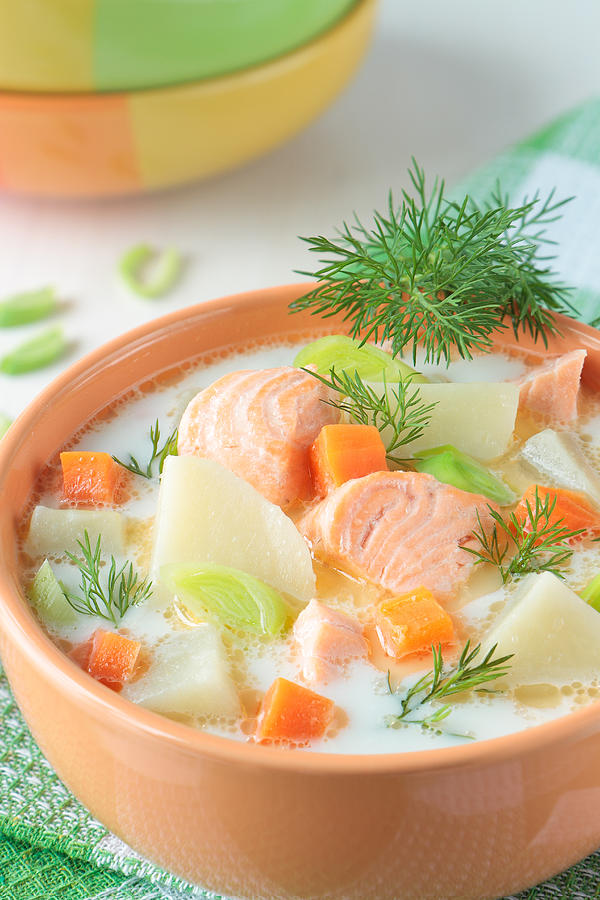 Salmon soup with cream, potatoes and carrots Photograph by Natalikaevsti