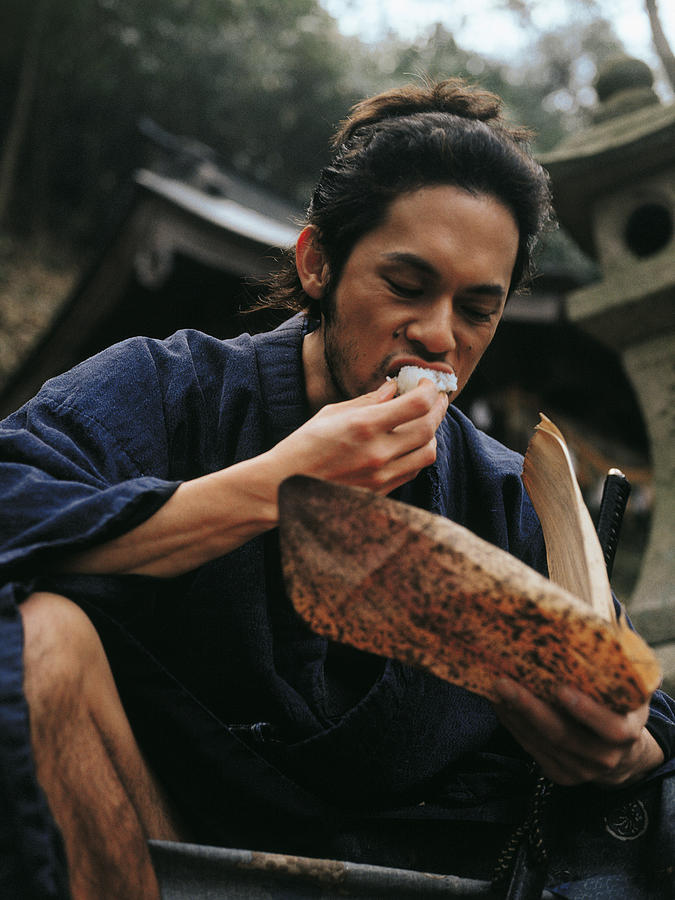 Samurai warrior eating food Photograph by Dex Image