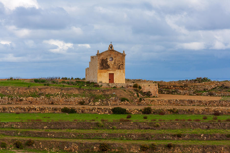 San Dimitri chapel against a cloudy backdrop, Gozo Malta Photograph by Flottmynd San Dimitri chapel against a cloudy backdrop, Gozo Malta Photograph by Flottmynd
