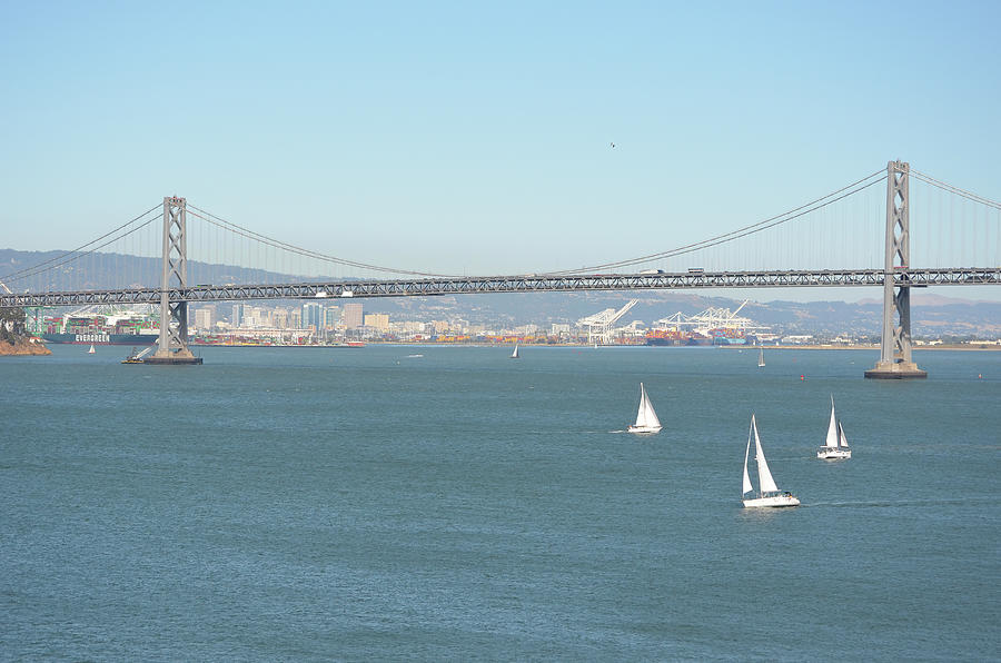 San Francisco to Oakland Bay Bridge and Sailboats Photograph by Shawn OBrien
