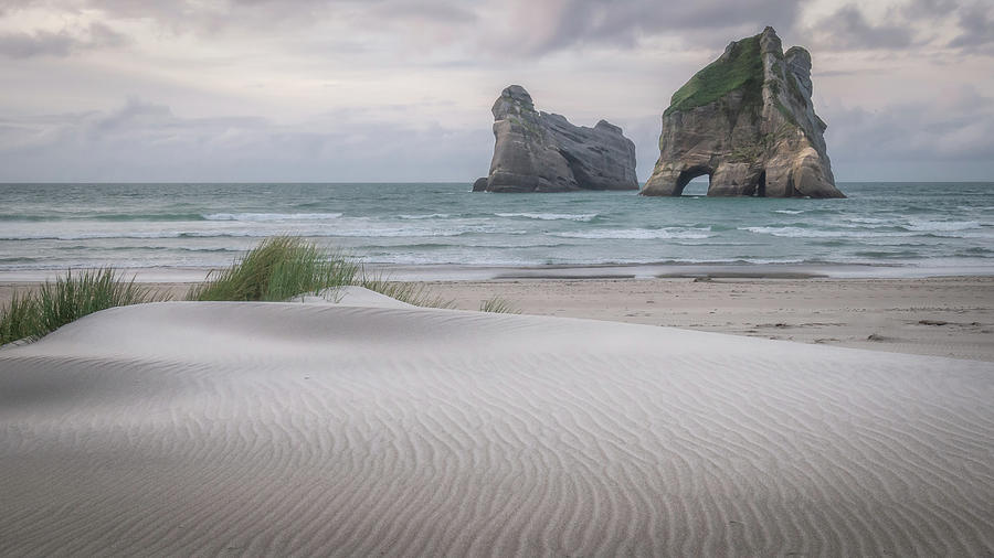 Sand Dunes and Archway Islands of Wharariki Beach During Sunset Photograph by Peter Kolejak