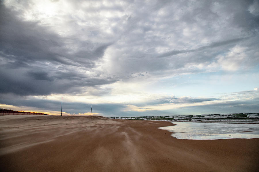 Sand flying on Grand Haven Michigan Beach Photograph by Eldon McGraw
