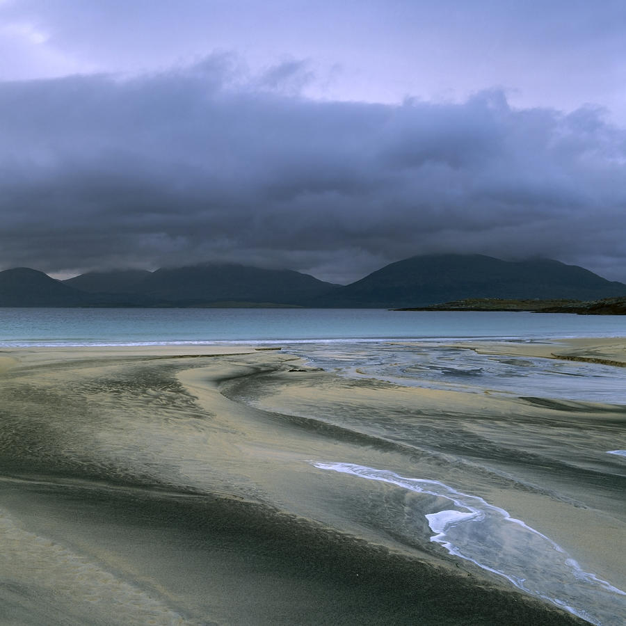 Sand patterns and view across to Taransay Photograph by David Henderson