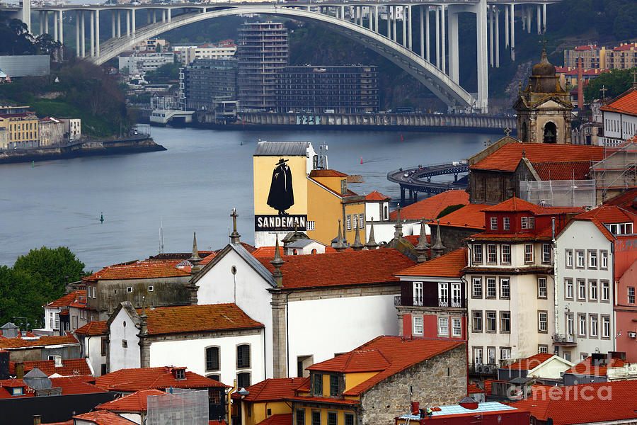 Sandeman port advert and Ponte da Arrabida bridge Porto Portugal Photograph by James Brunker