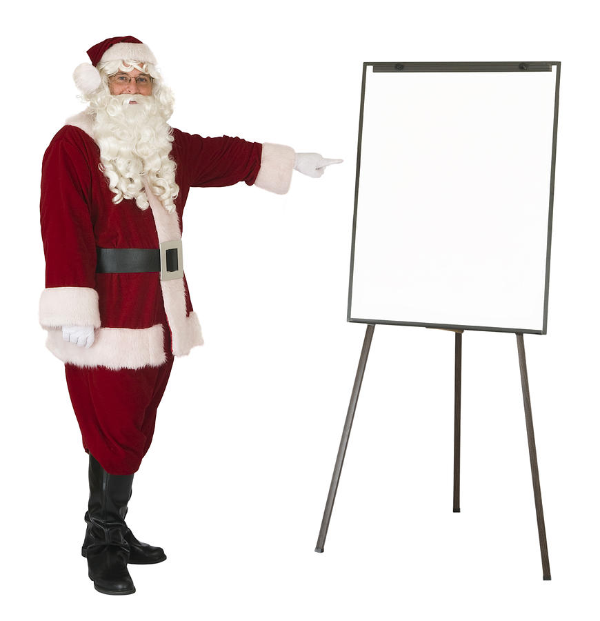 Santa Claus pointing to an isolated whiteboard Photograph by Leezsnow