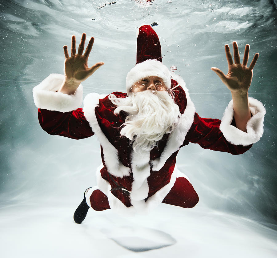 Santa Claus under water Photograph by Henrik Sorensen
