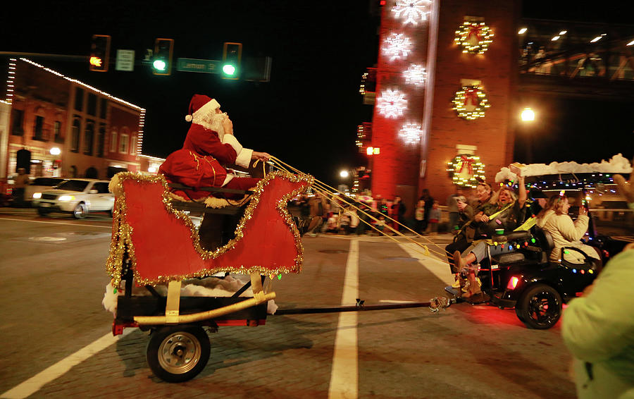 Santas girls, Golf Cart Parade. Photograph by Dennis Baswell