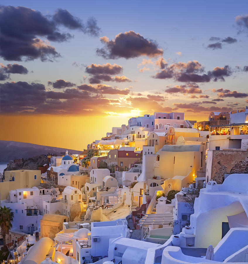 Santorini sunset over the village of Oia in Greece Photograph by Grafissimo