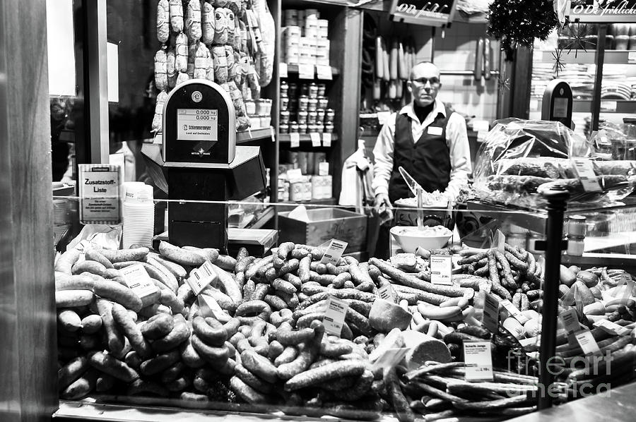 Sausages in Munich at Night Photograph by John Rizzuto