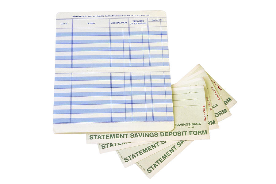 Savings account book and deposit forms Photograph by Comstock