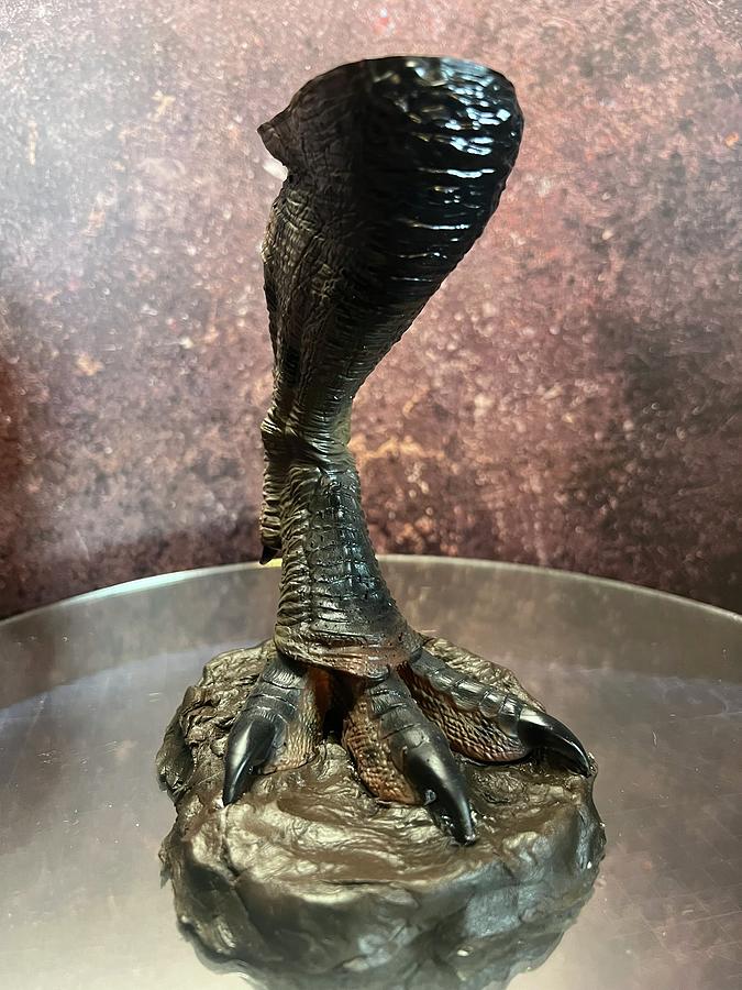 Scale replica T Rex foot stepping in mud from Jurassic Park Sculpture by Michael McKenzie