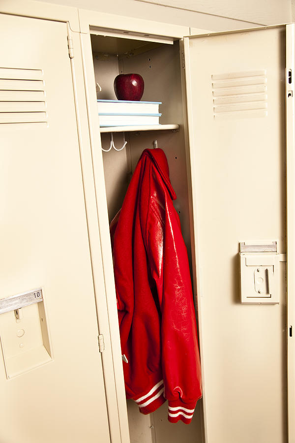 School locker with jacket, books and apple Photograph by Fstop123