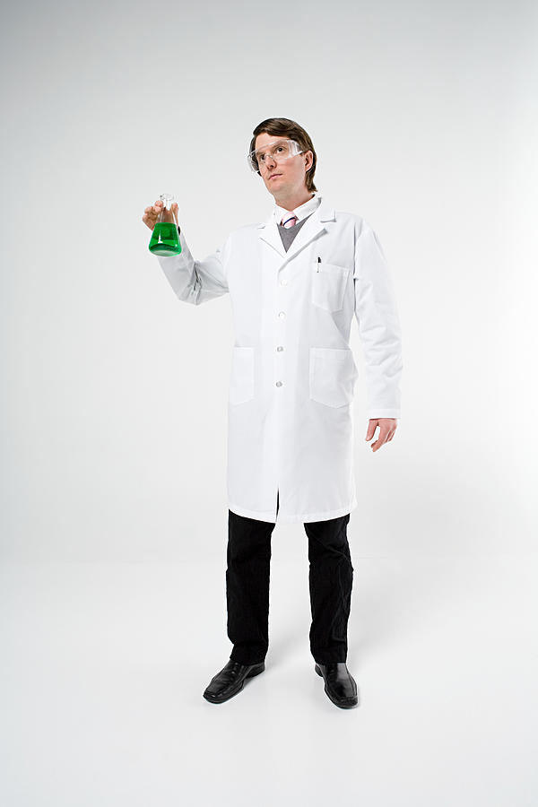 Scientist holding flask Photograph by Image Source