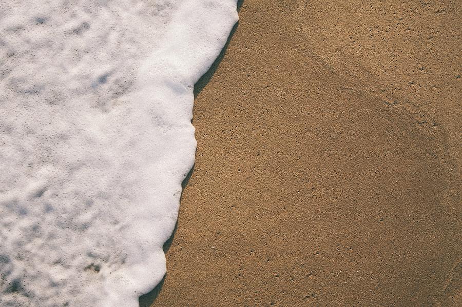 Sea Foam On Sand Photograph