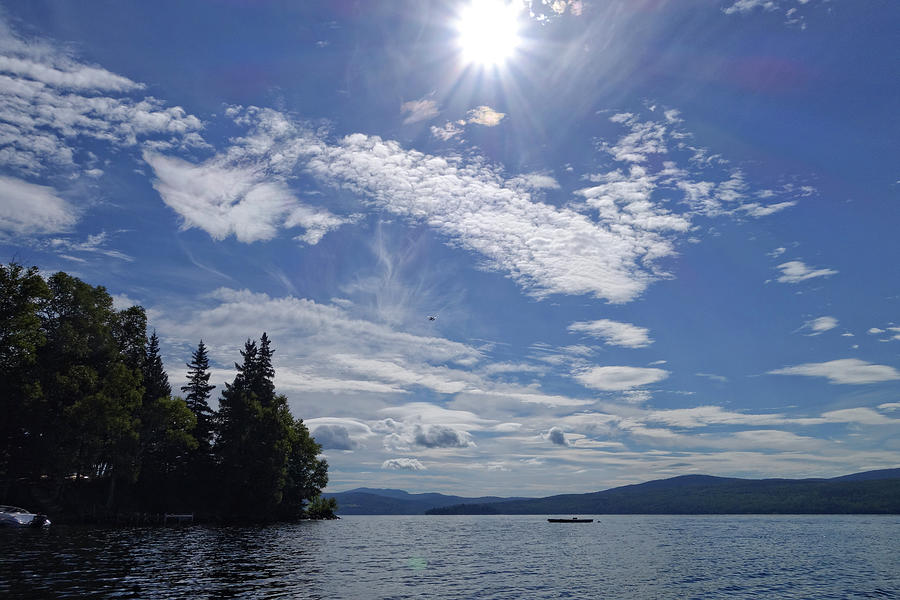 Seaplane, Sun and Clouds Over Lake Photograph by Russel Considine