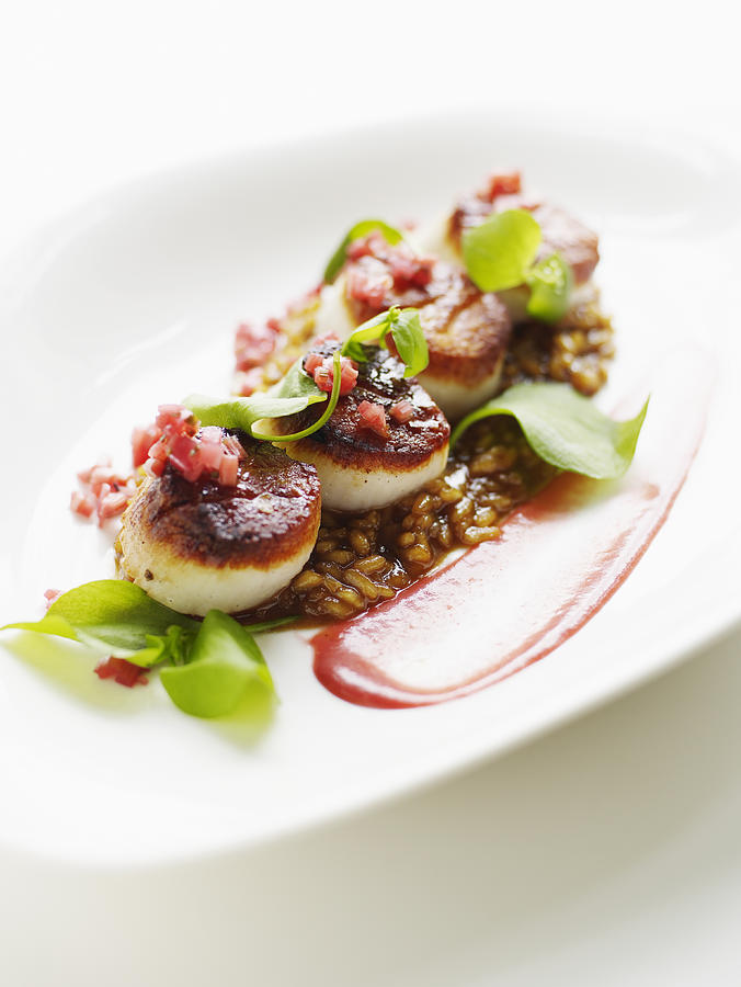 Seared rare scallops with sweet onion risotto and rhubarb Photograph by Thomas Barwick