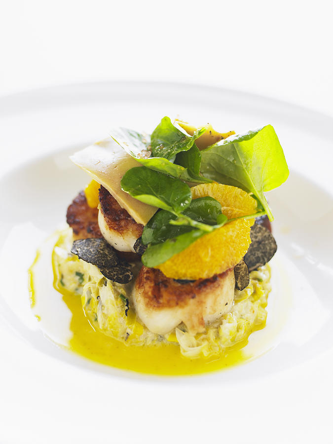 Seared sea scallops with truffle creamed leek and citrus cress Photograph by Thomas Barwick