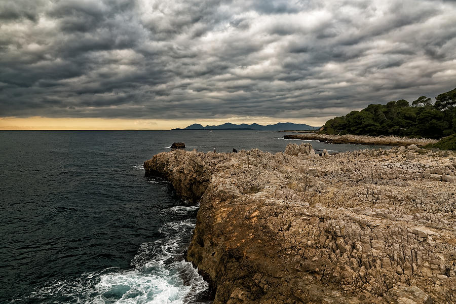 Seascape and sunset with cloudy sky Photograph by Jean-Marc PAYET