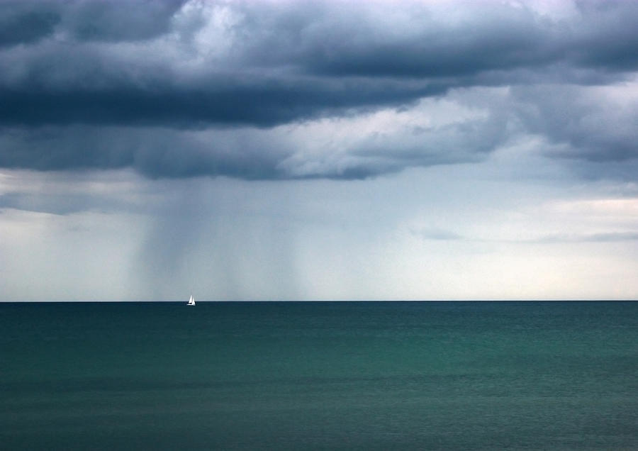 Seascape with a single sailing boat Photograph by Catherine MacBride