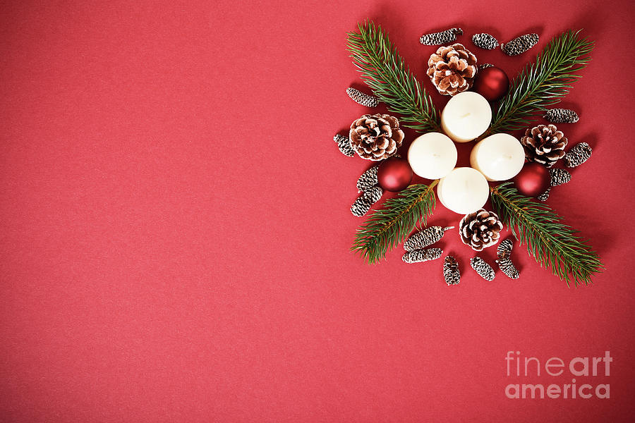 Seasonal greeting card concept with candles, pine cones and everg Photograph by Mendelex Photography