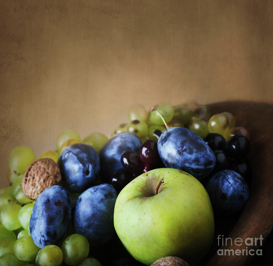 Seasonal thanksgiving fruit in wooden bowl. Photograph by Jelena Jovanovic