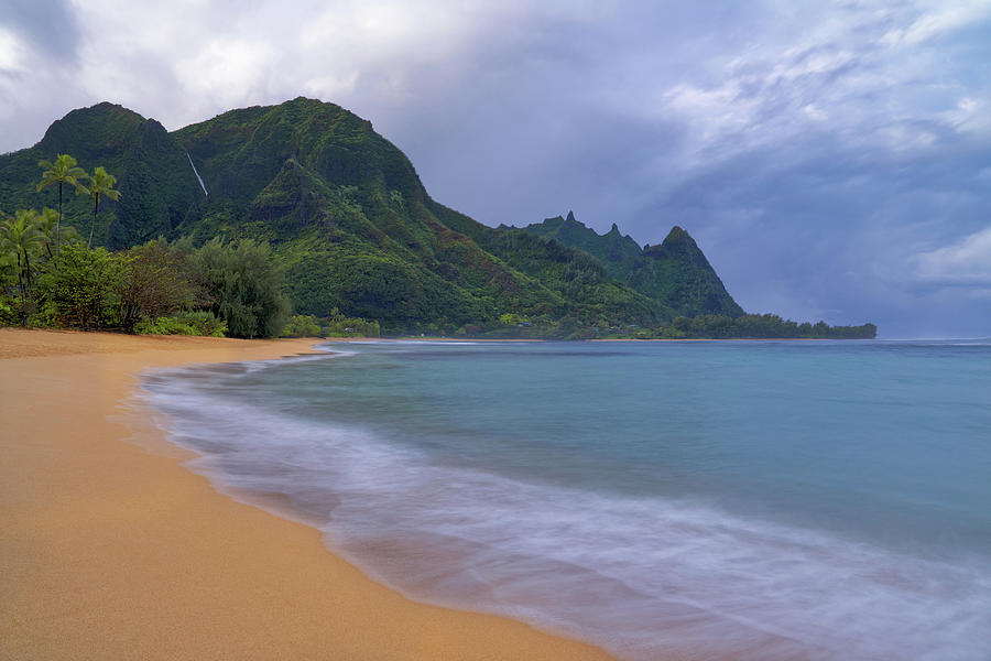 Seasonal waterfall freely flows down Mount Makana during morning rain ...